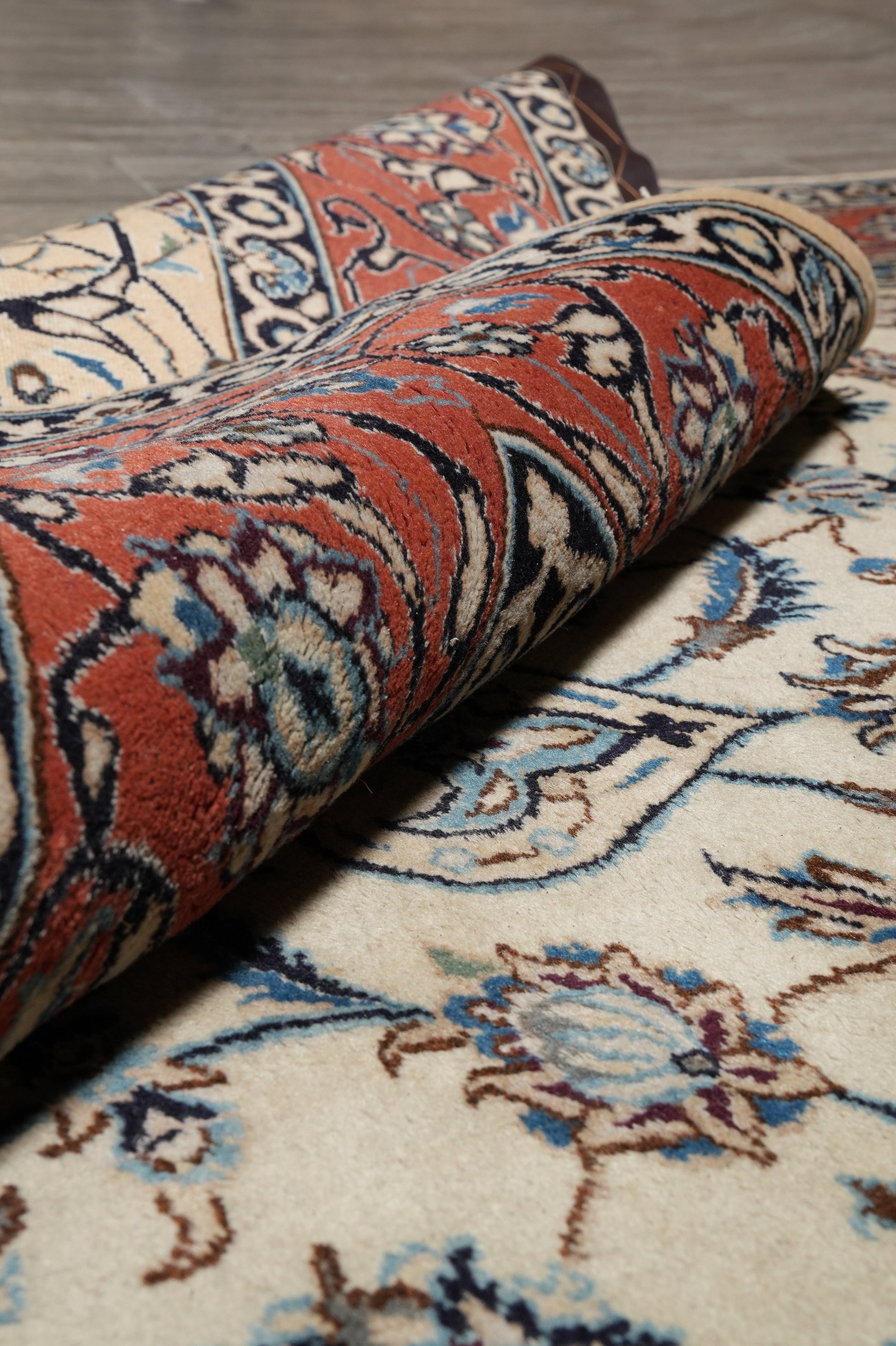 Tabriz-style ivory rug, mid-field detail