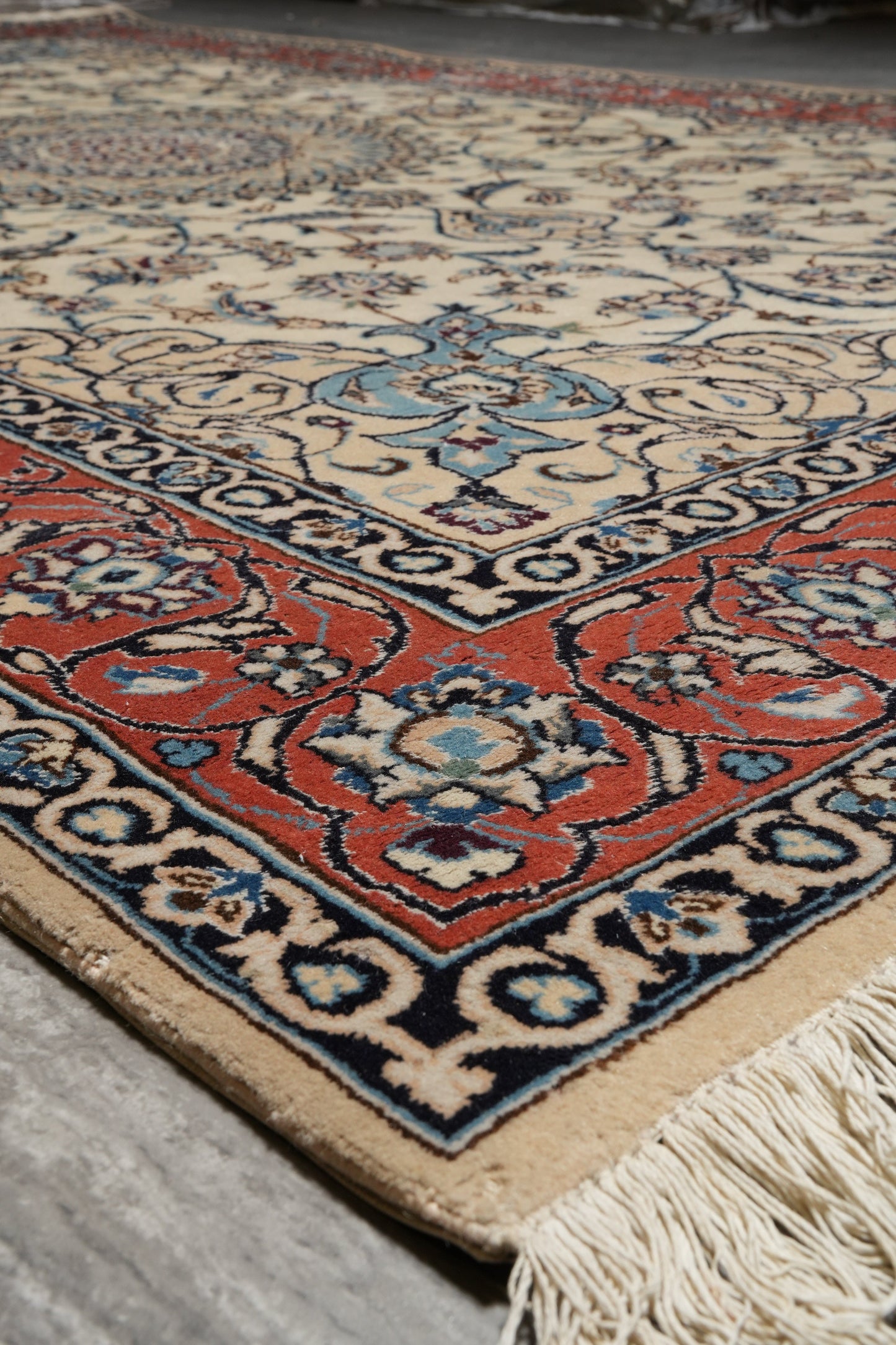 Tabriz-style ivory rug, fourth floral cluster detail