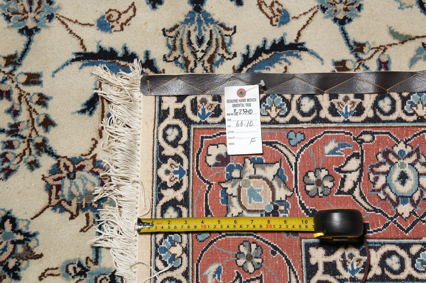 Tabriz-style ivory rug, edge and selvedge close-up