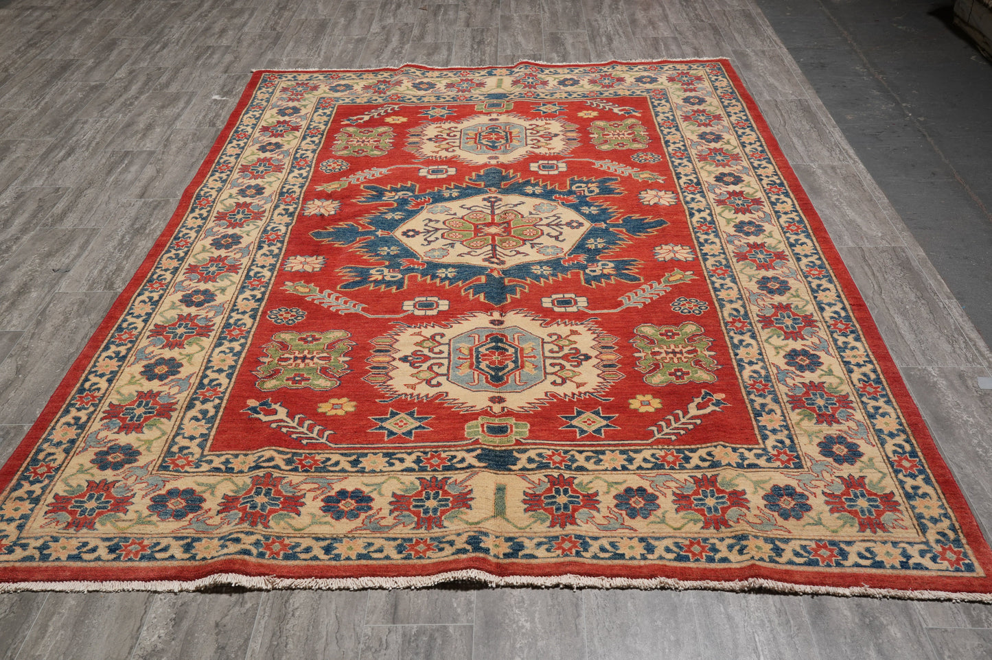 Afghan Kazak rug, central medallion close-up in red and ivory
