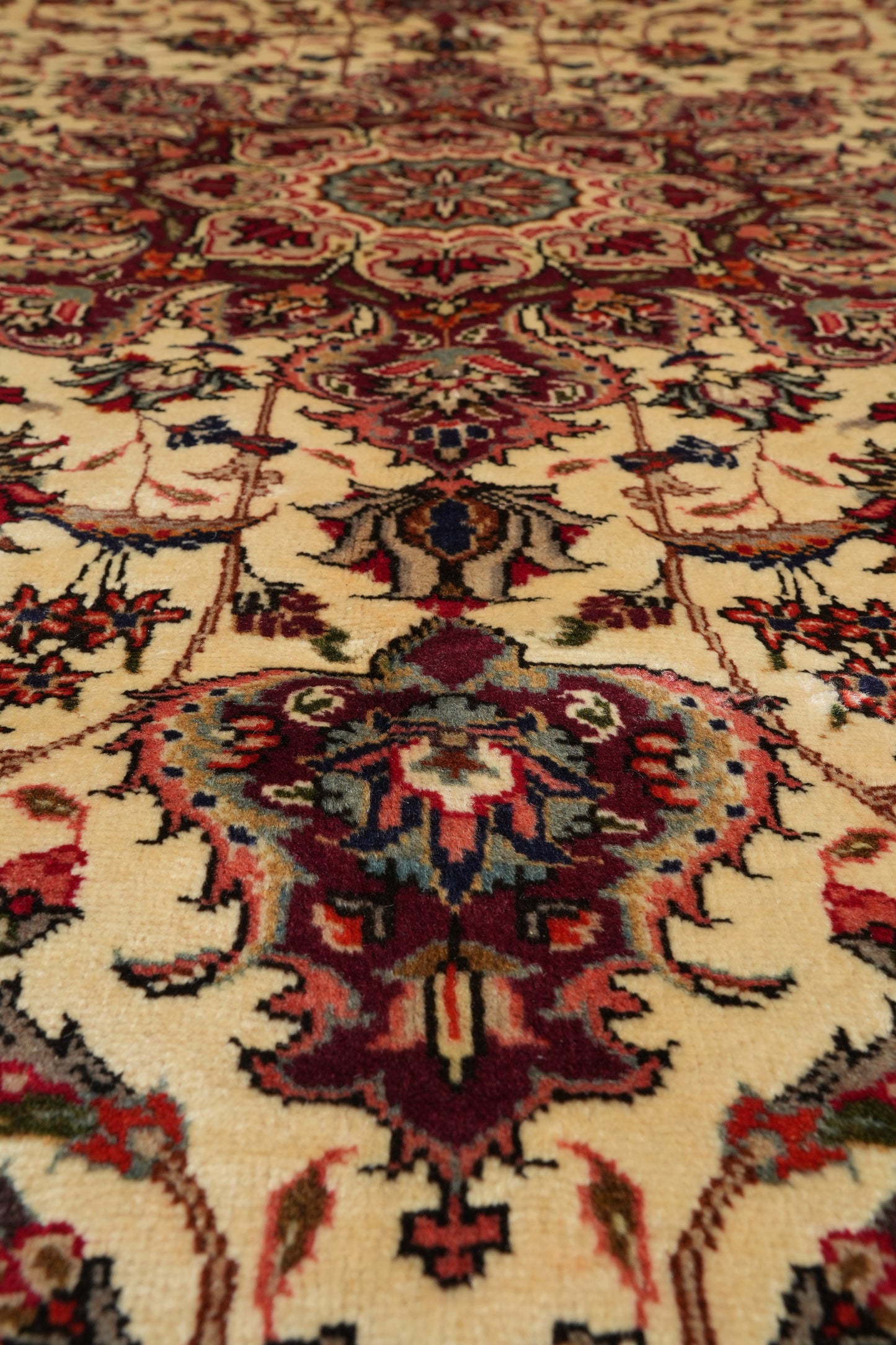 Esfahan-style rug, color balance close-up showing red and navy
