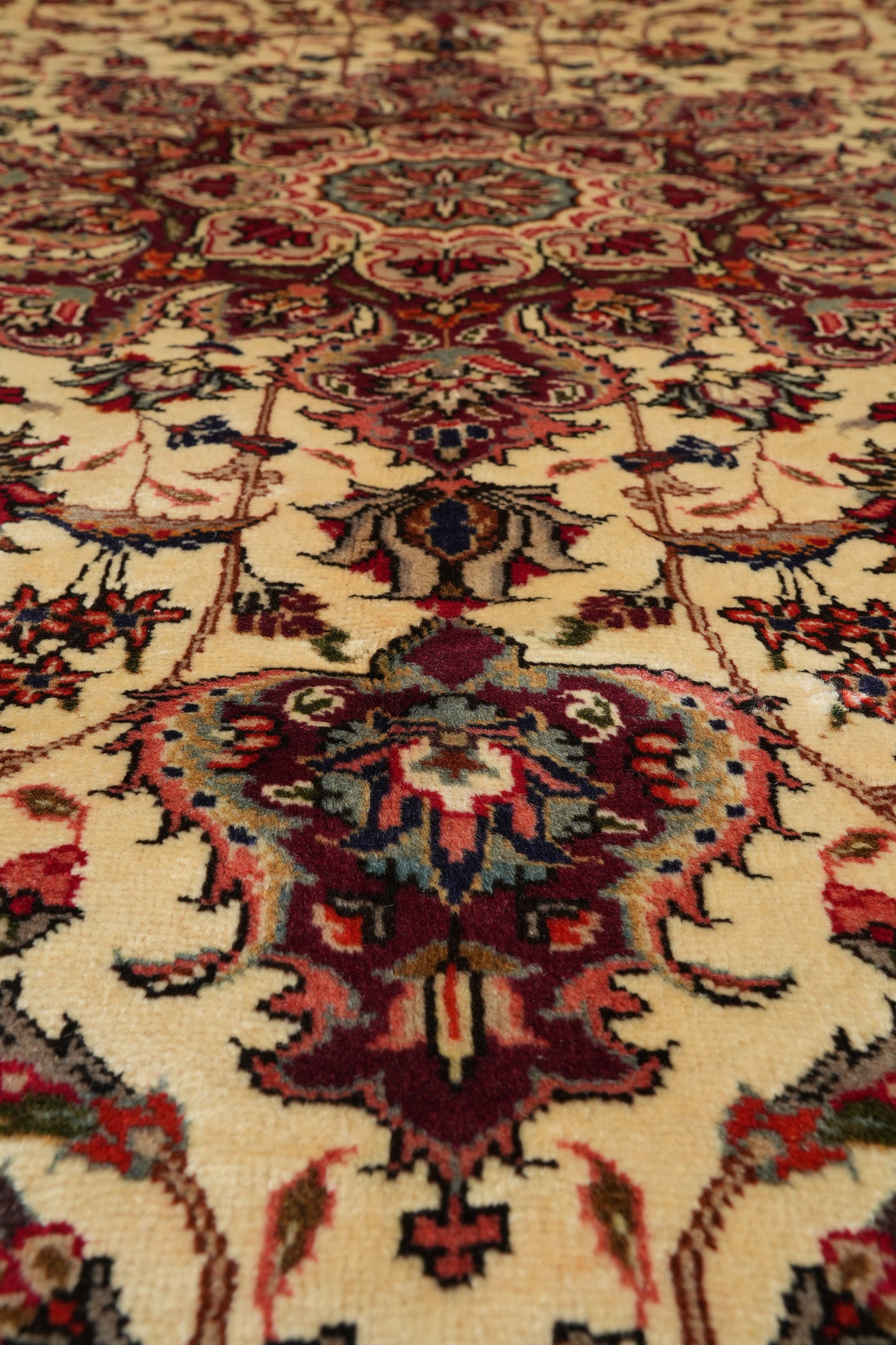 Esfahan-style rug, color balance close-up showing red and navy