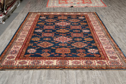 Silky navy Super Kazak rug, ivory and red tribal motif detail