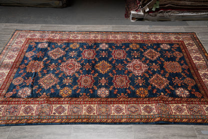 Silky navy Super Kazak rug, border pattern close-up