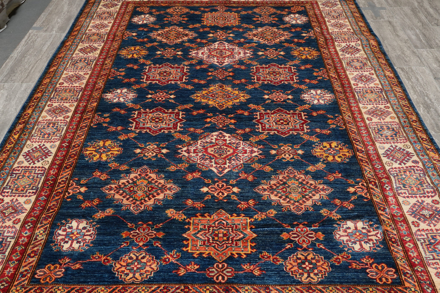 Silky navy Super Kazak rug, corner motif with tribal geometry