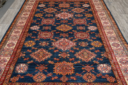 Silky navy Super Kazak rug, corner motif with tribal geometry
