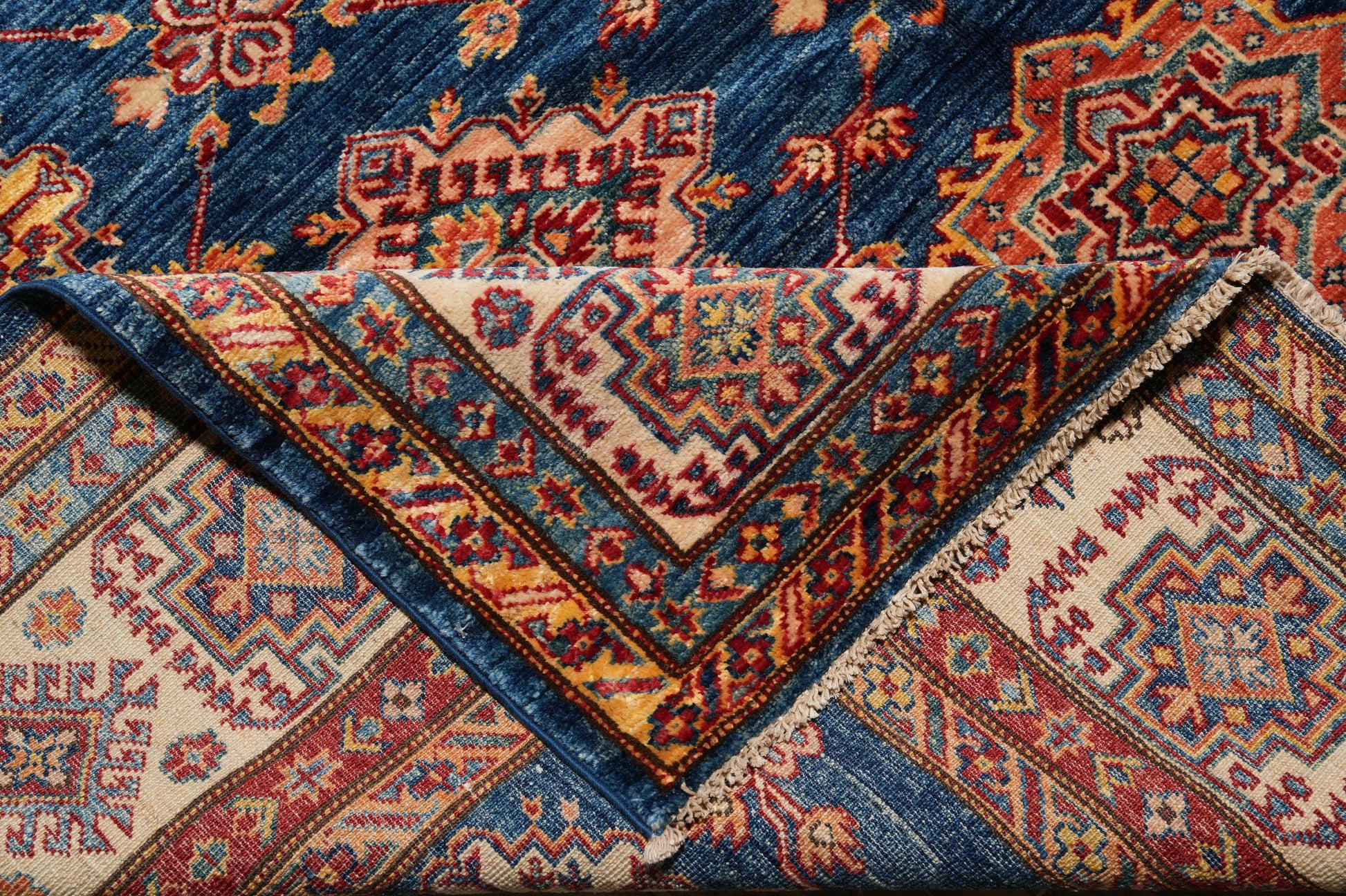Silky navy Super Kazak rug, secondary medallion close-up