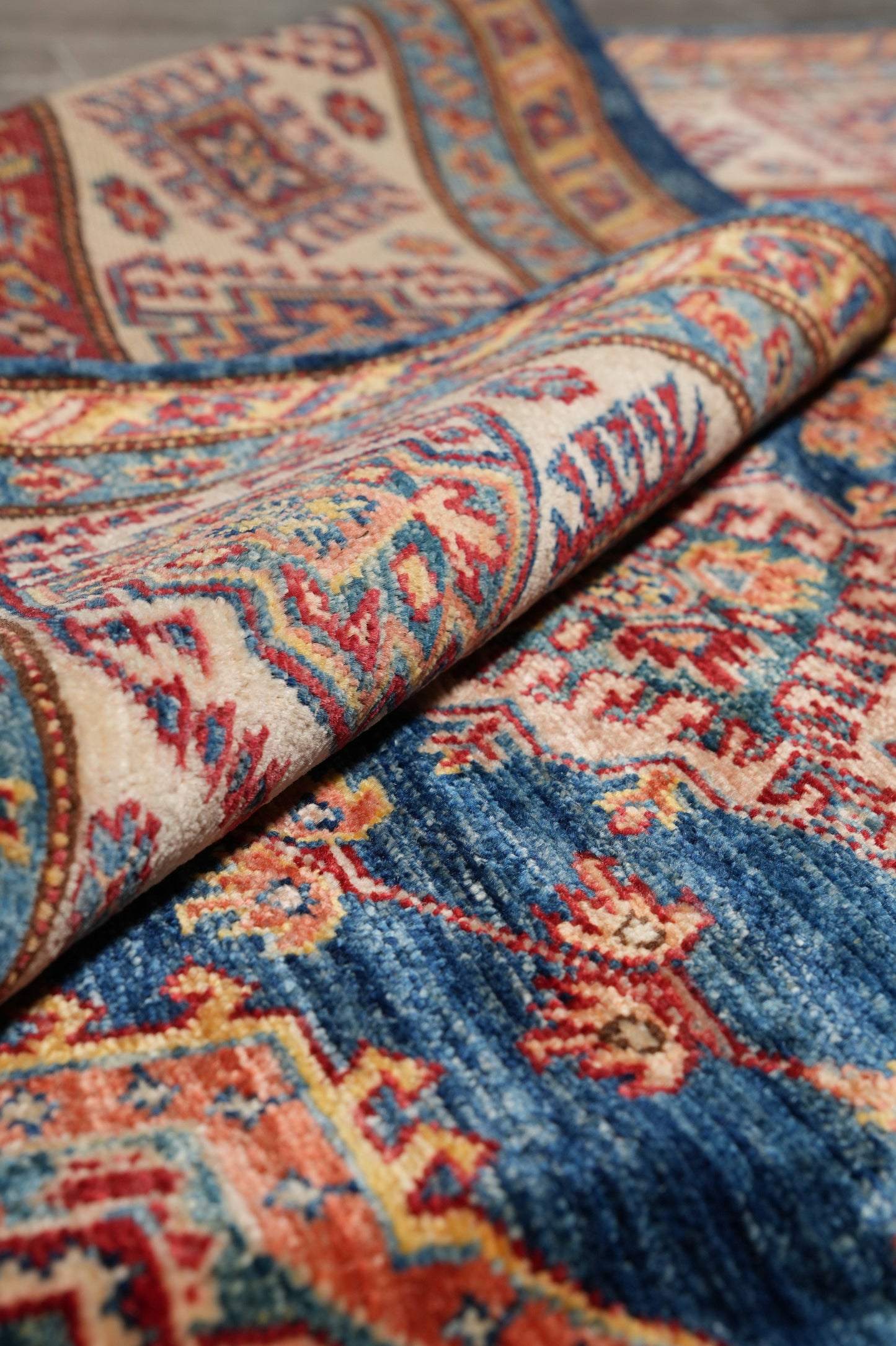 Silky navy Super Kazak rug, color balance close-up of navy field
