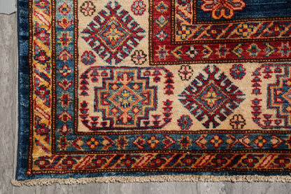 Silky navy Super Kazak rug, alternate corner pattern continuity