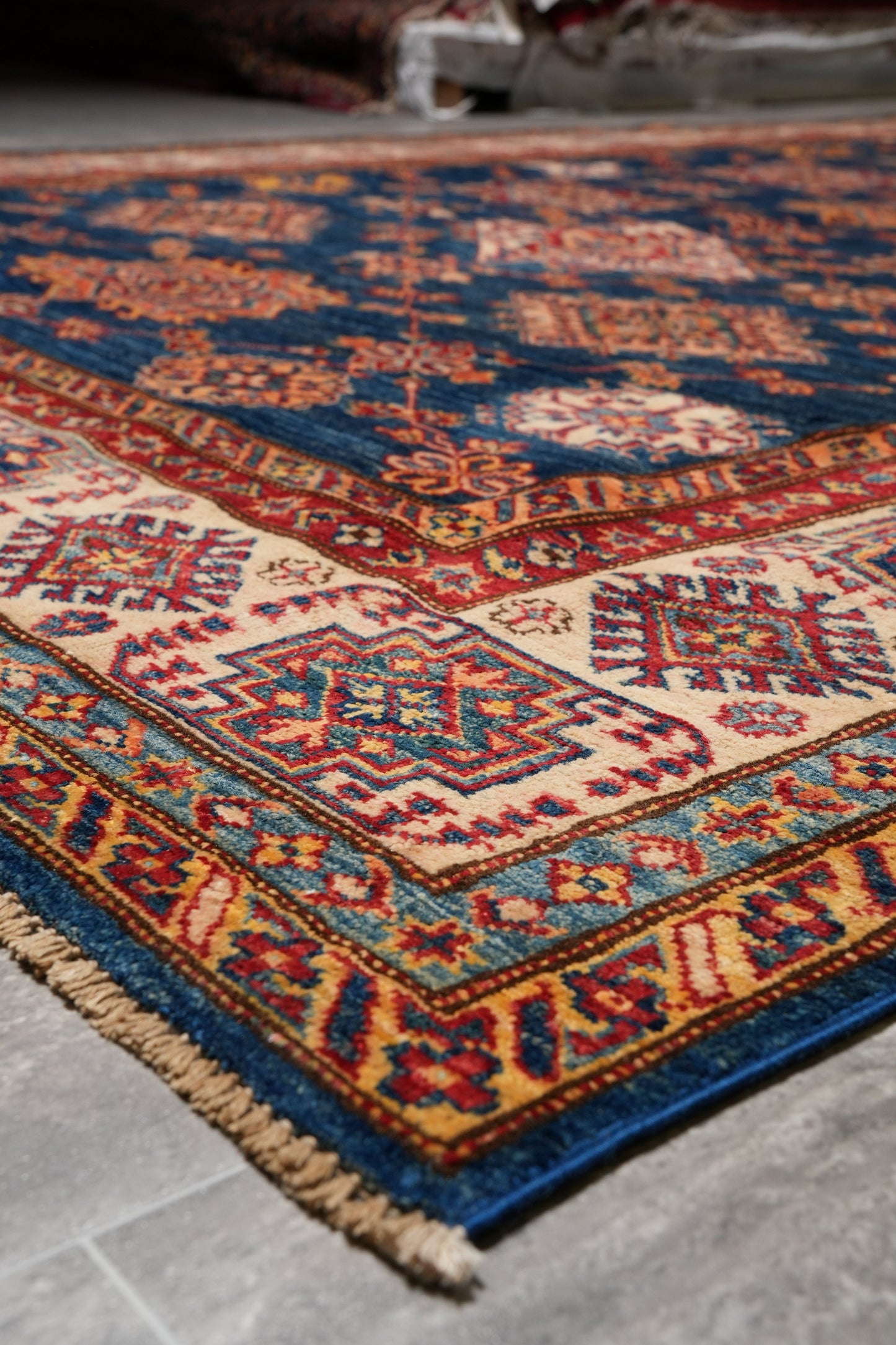Silky navy Super Kazak rug, mid-field detail