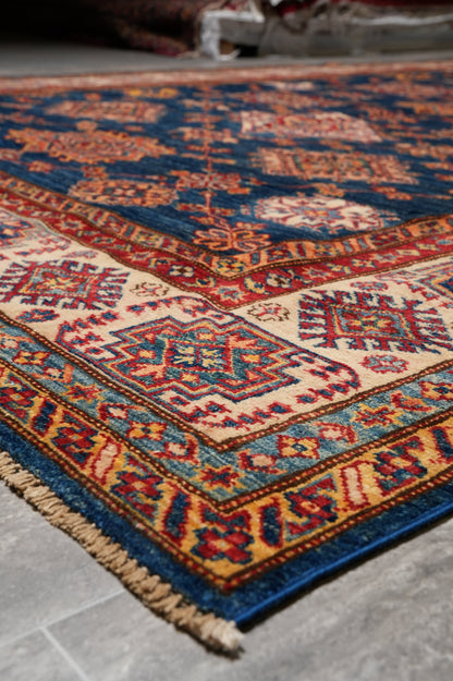 Silky navy Super Kazak rug, mid-field detail