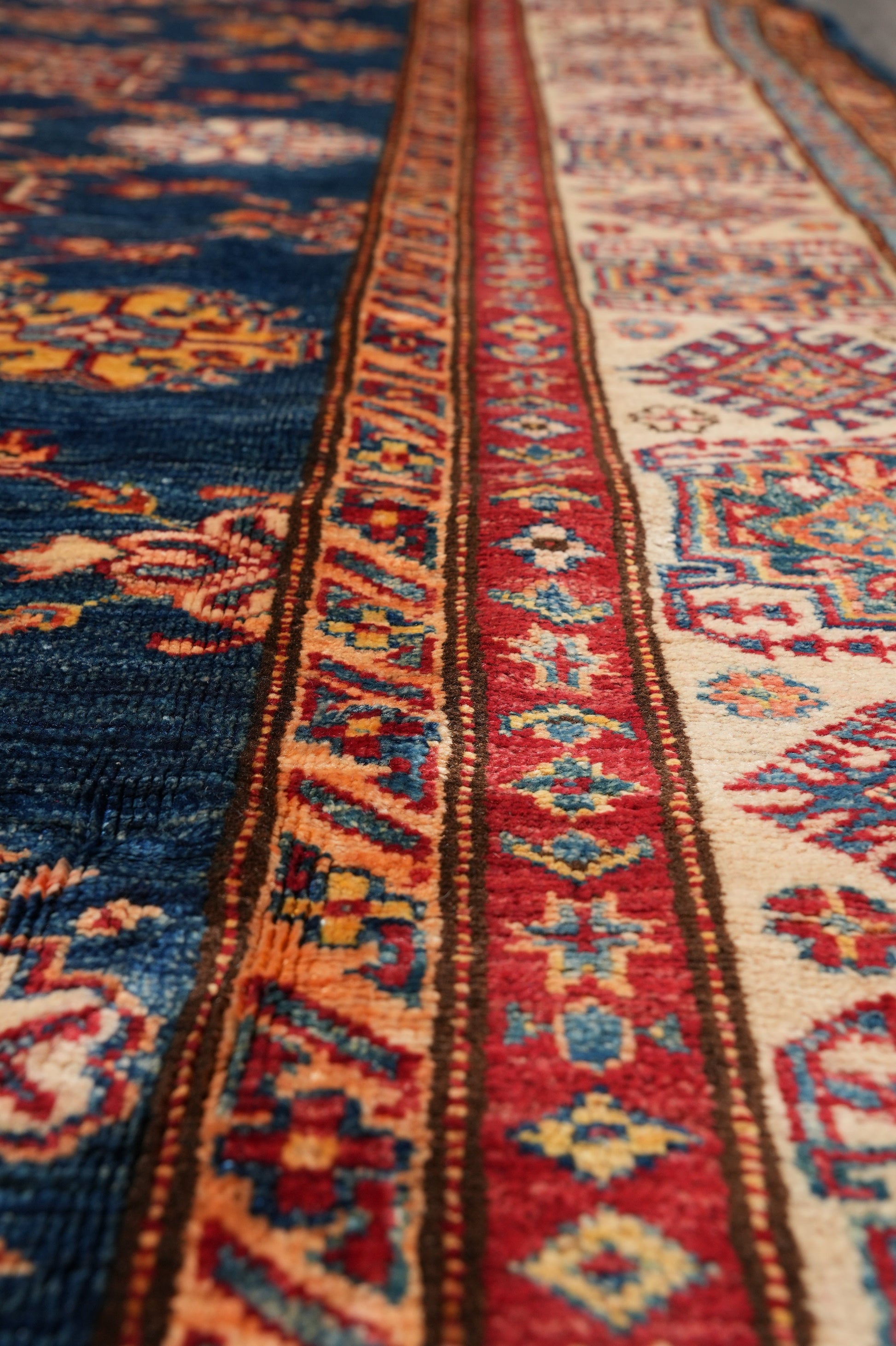 Silky navy Super Kazak rug, secondary border pattern