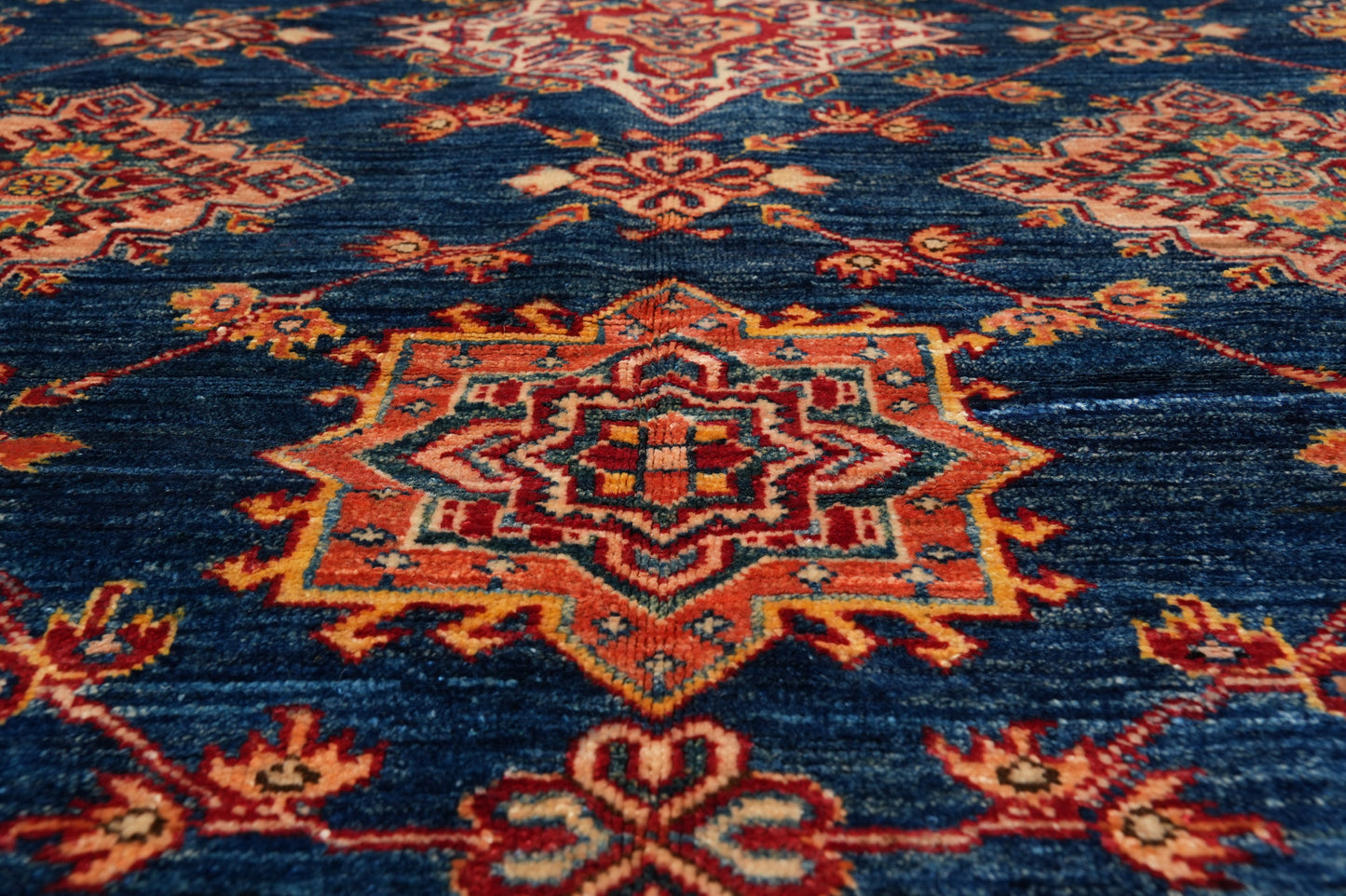 Silky navy Super Kazak rug, edge and selvedge close-up