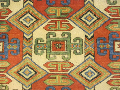 Afghan Chechen Kazak 6x7 rug, central medallion close-up in red and ivory