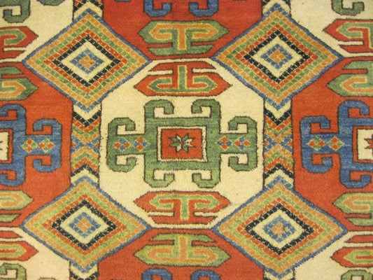 Afghan Chechen Kazak 6x7 rug, central medallion close-up in red and ivory