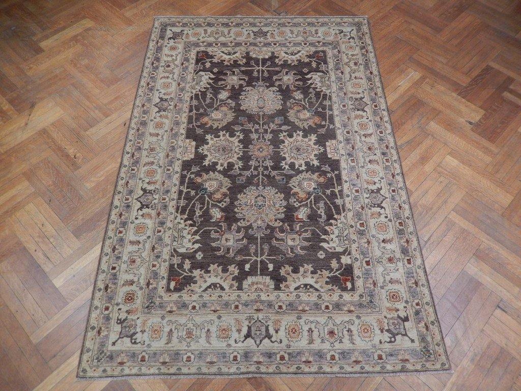 Chobi Peshawar rug, central motif close-up showing vegetal-dye depth