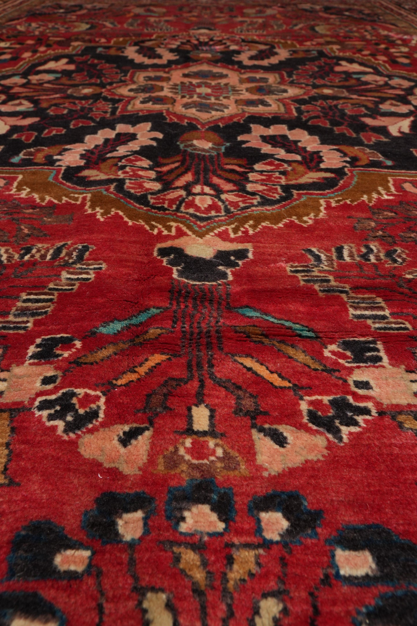 Semi-antique traditional floral rug, alternate corner pattern continuity