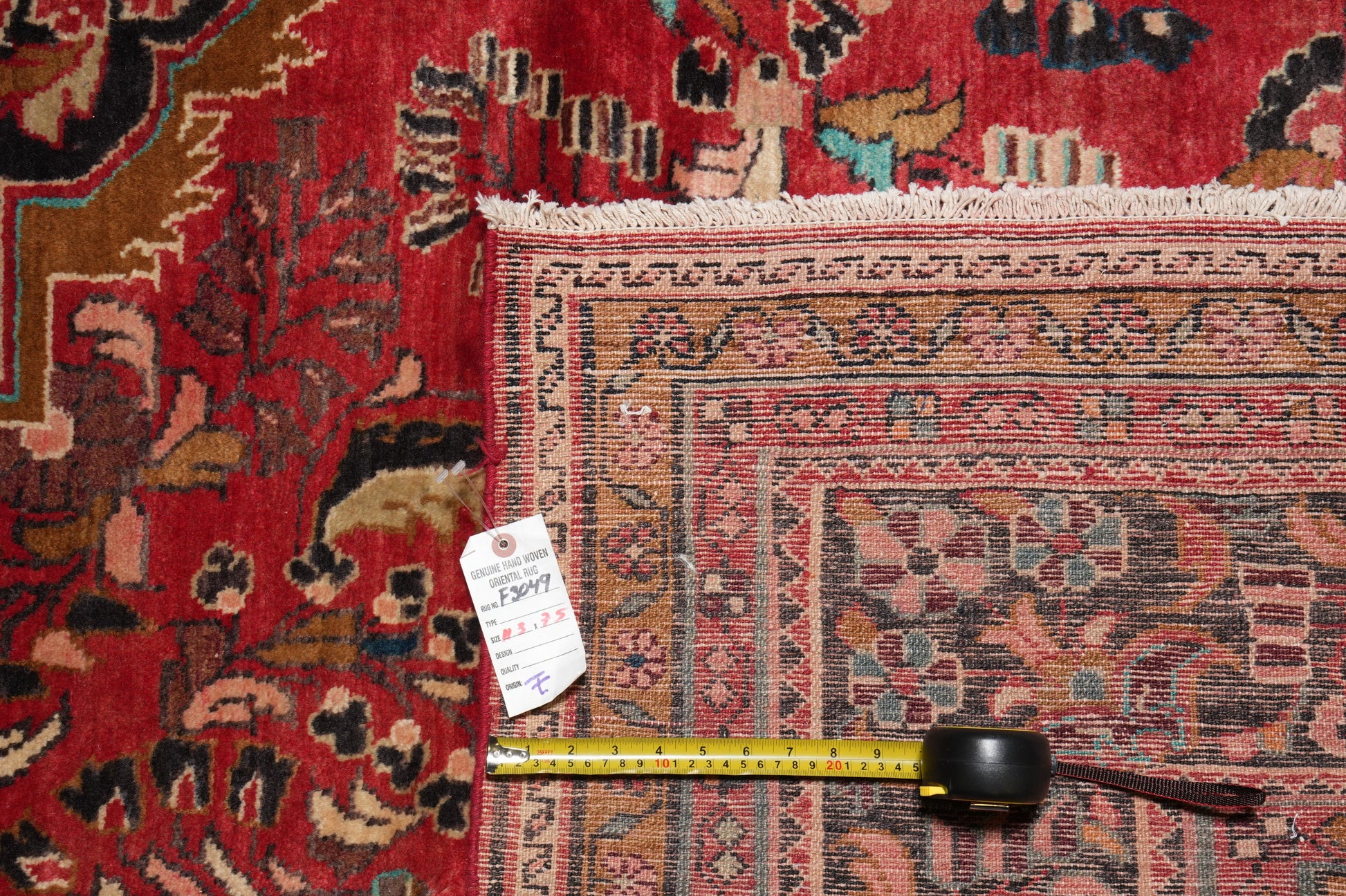 Semi-antique traditional floral rug, edge and selvedge close-up