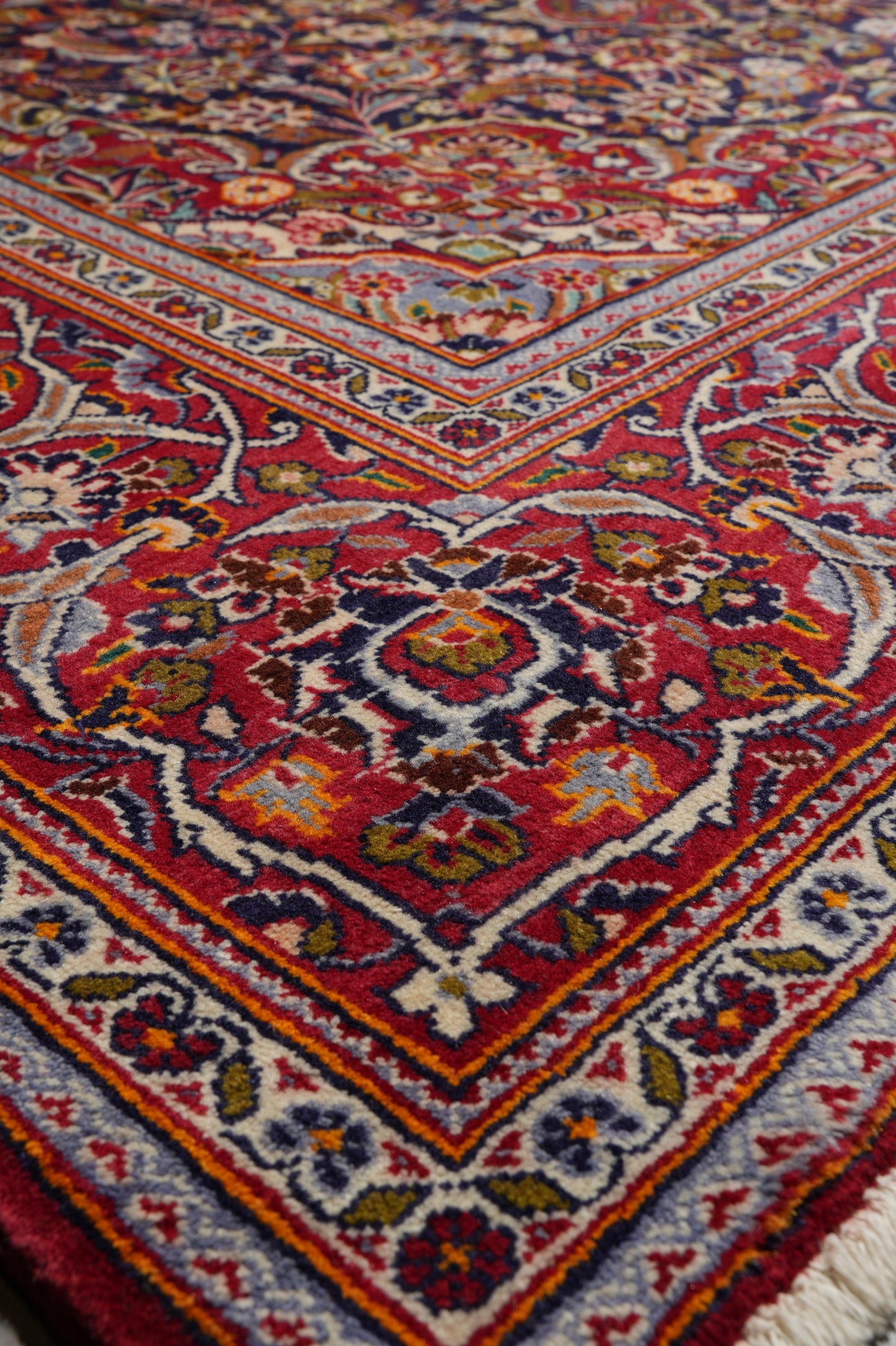 Kashan-style navy rug, border pattern with refined detail