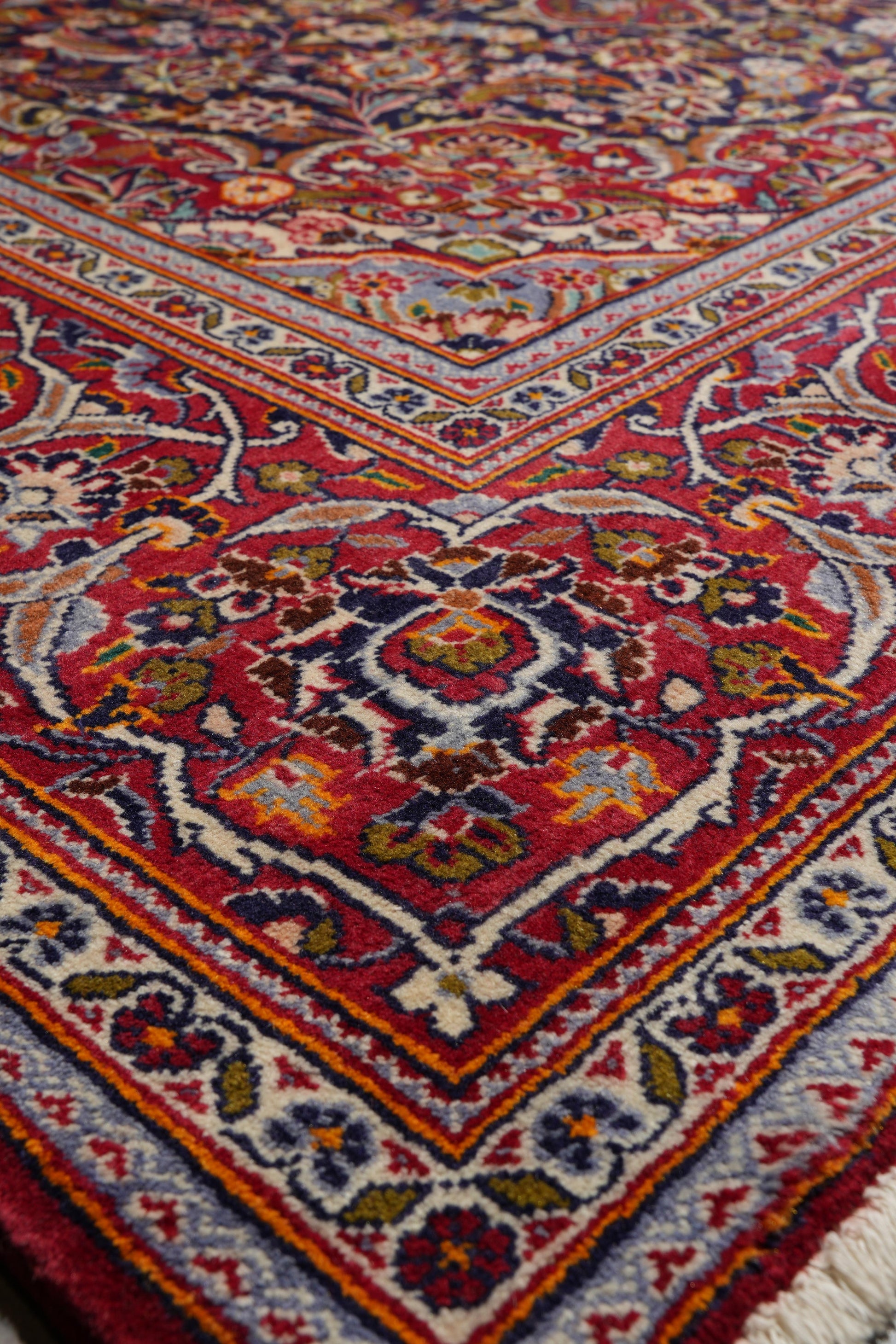 Kashan-style navy rug, border pattern with refined detail