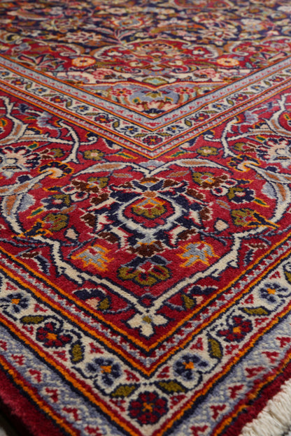 Kashan-style navy rug, border pattern with refined detail