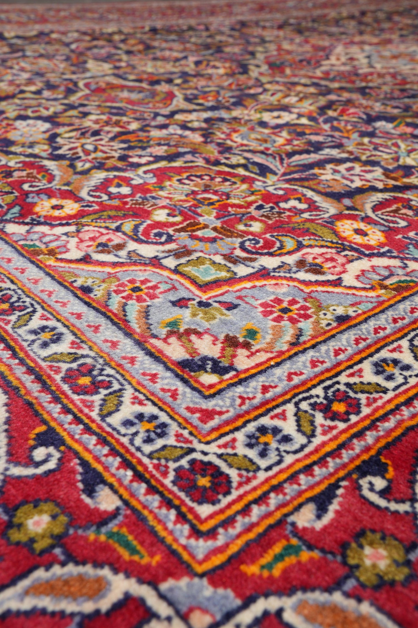 Kashan-style navy rug, secondary medallion close-up