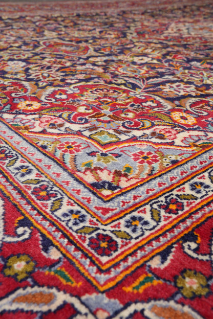 Kashan-style navy rug, secondary medallion close-up