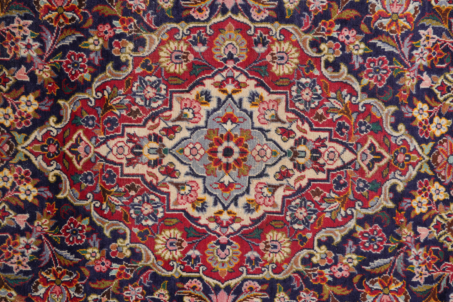 Kashan-style navy rug, alternate corner with floral continuity