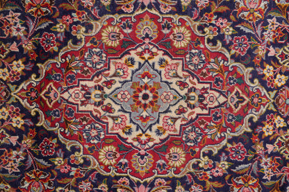 Kashan-style navy rug, alternate corner with floral continuity