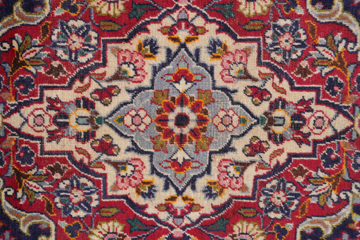 Kashan-style navy rug, secondary border pattern detail