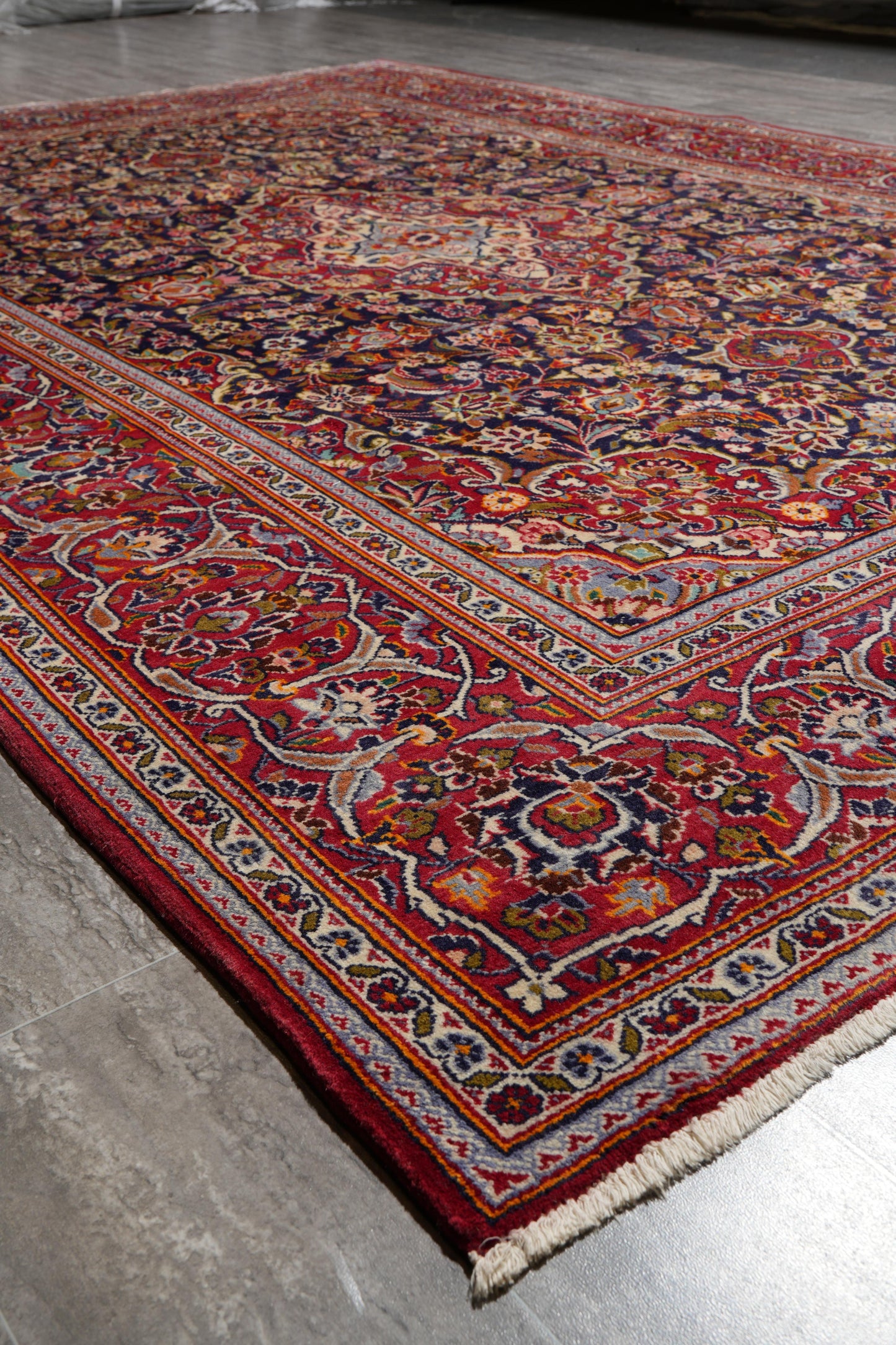 Kashan-style navy rug, edge and selvedge close-up