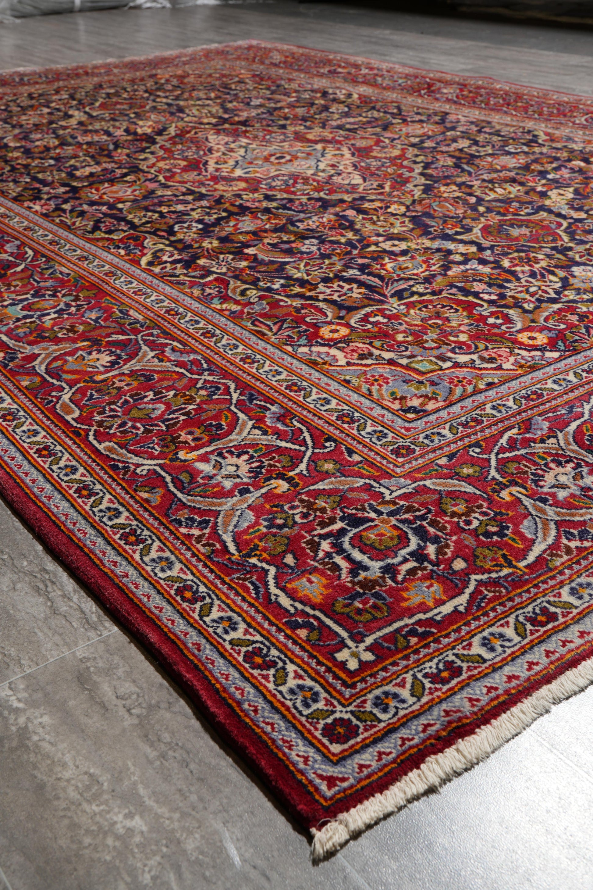 Kashan-style navy rug, edge and selvedge close-up
