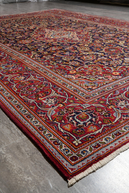 Kashan-style navy rug, edge and selvedge close-up
