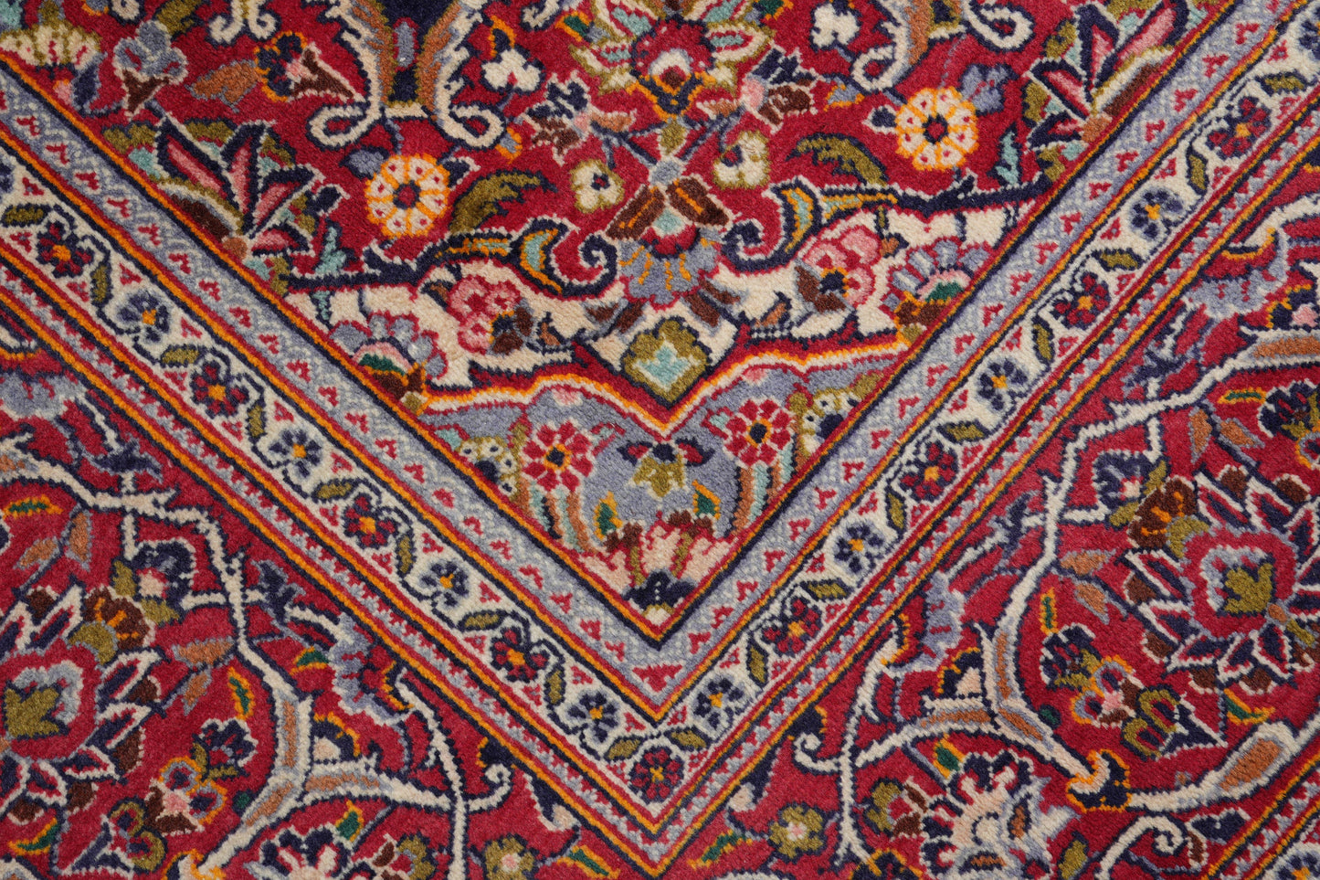 Kashan-style navy rug, pile texture detail showing dense wool