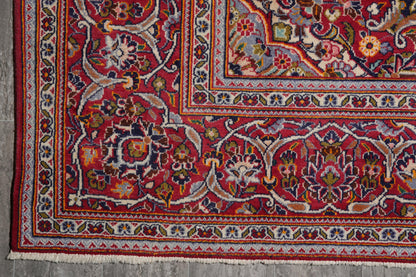 Kashan-style navy rug, partial overhead view in natural light