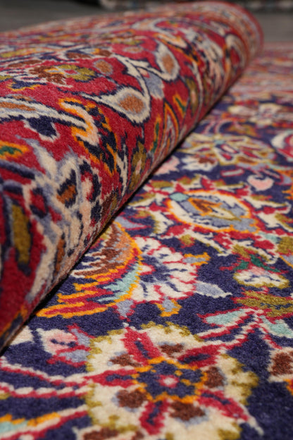 Kashan-style navy rug, alternate angle showing full layout