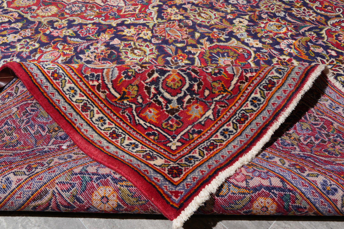 Kashan-style navy rug, color depth close-up of navy field