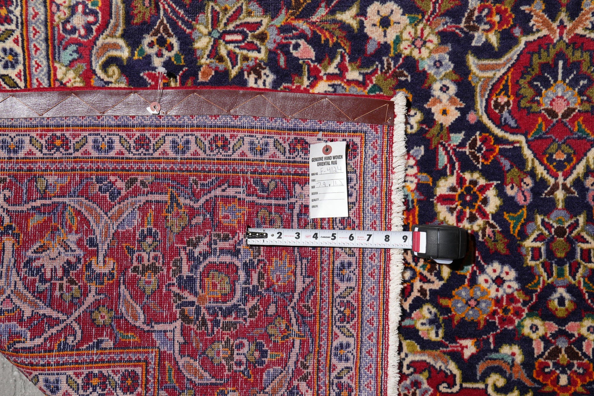 Kashan-style navy rug, wide alternate-angle full layout
