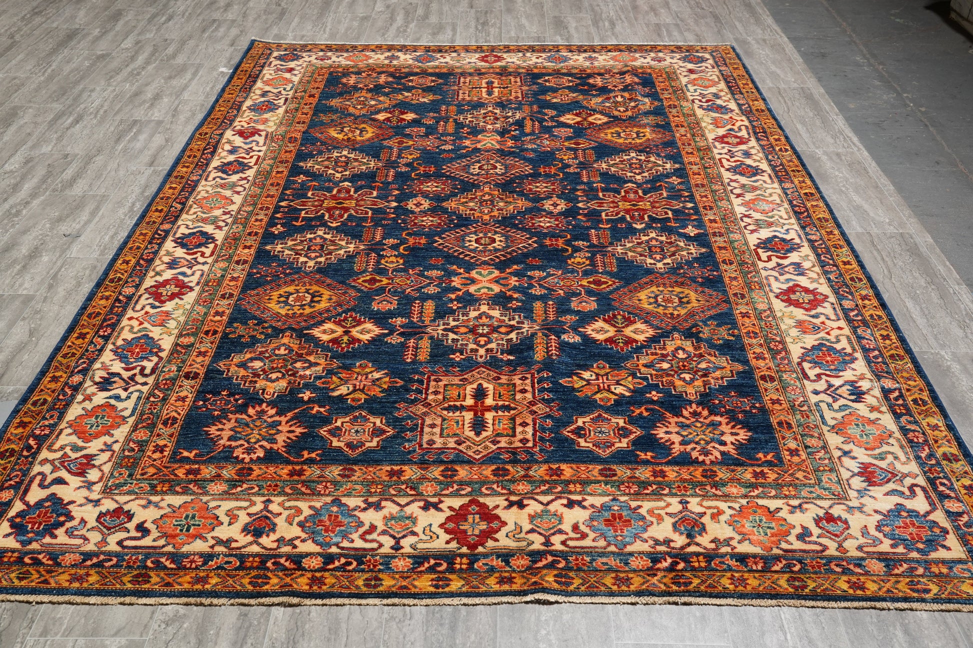 Royal blue Super Kazak rug, central medallion close-up in ivory and red