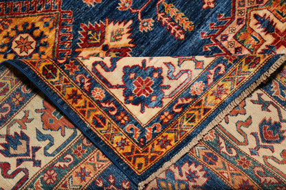 Royal blue Super Kazak rug, corner motif with tribal geometry
