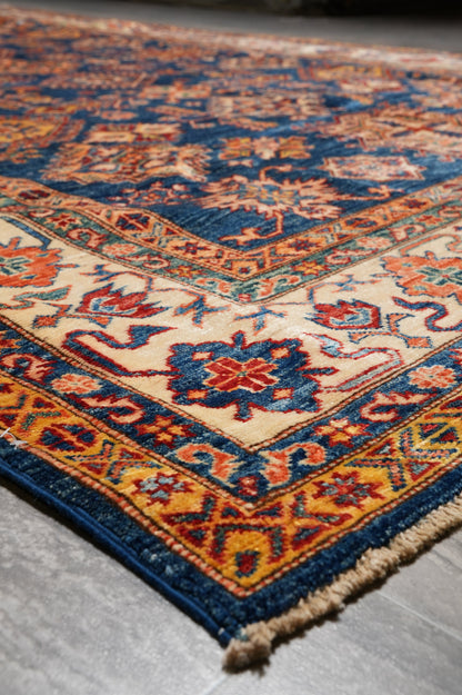 Royal blue Super Kazak rug, alternate corner showing pattern continuity