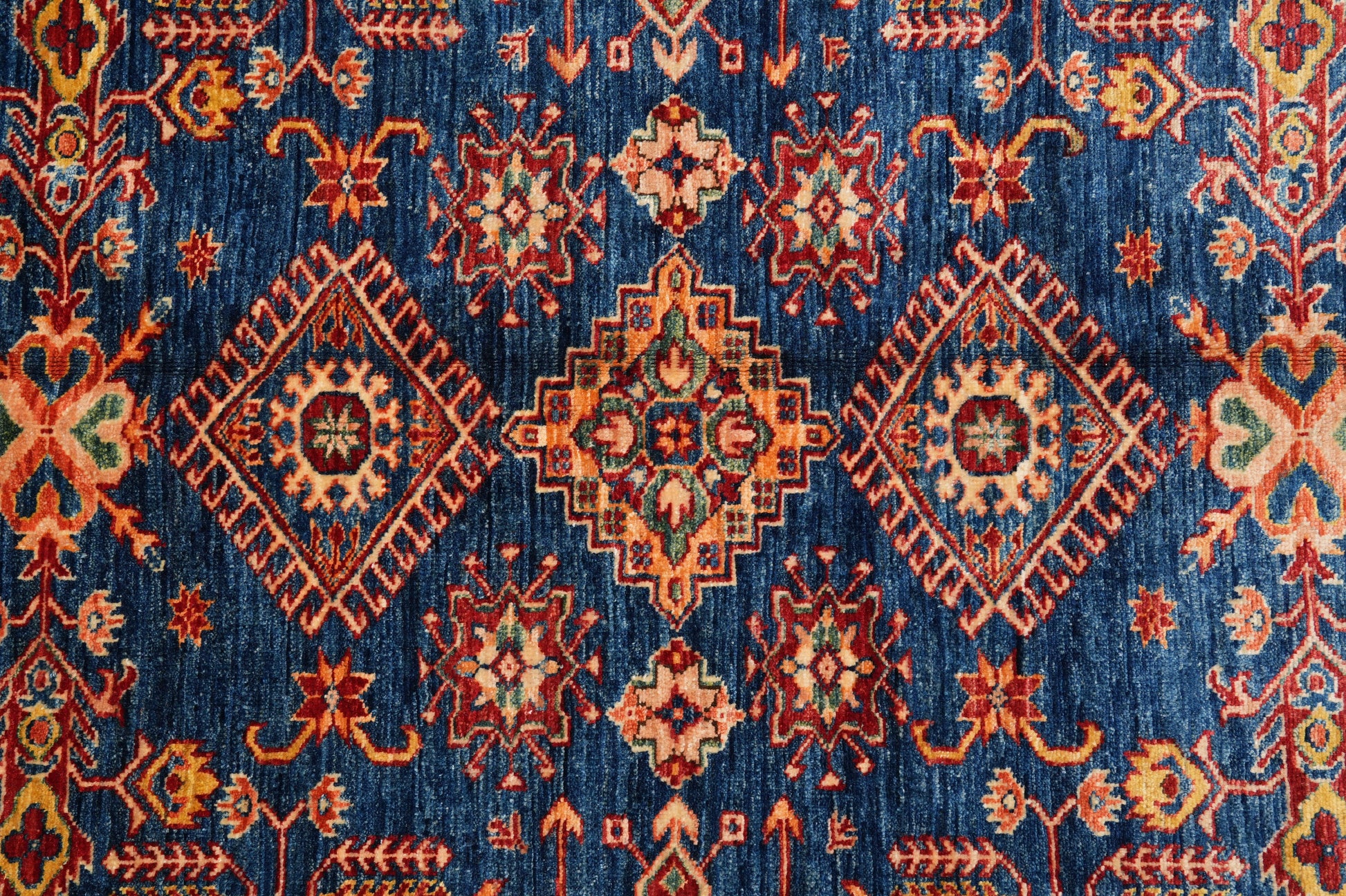 Royal blue Super Kazak rug, pile texture showing silky Afghan wool