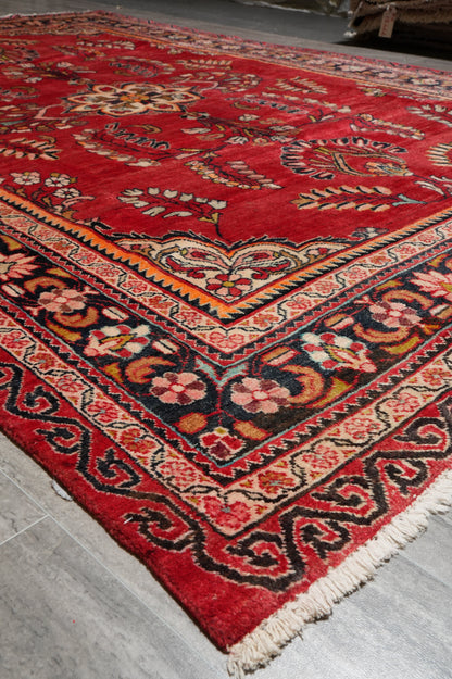 Vintage traditional floral rug, pile texture showing aged wool
