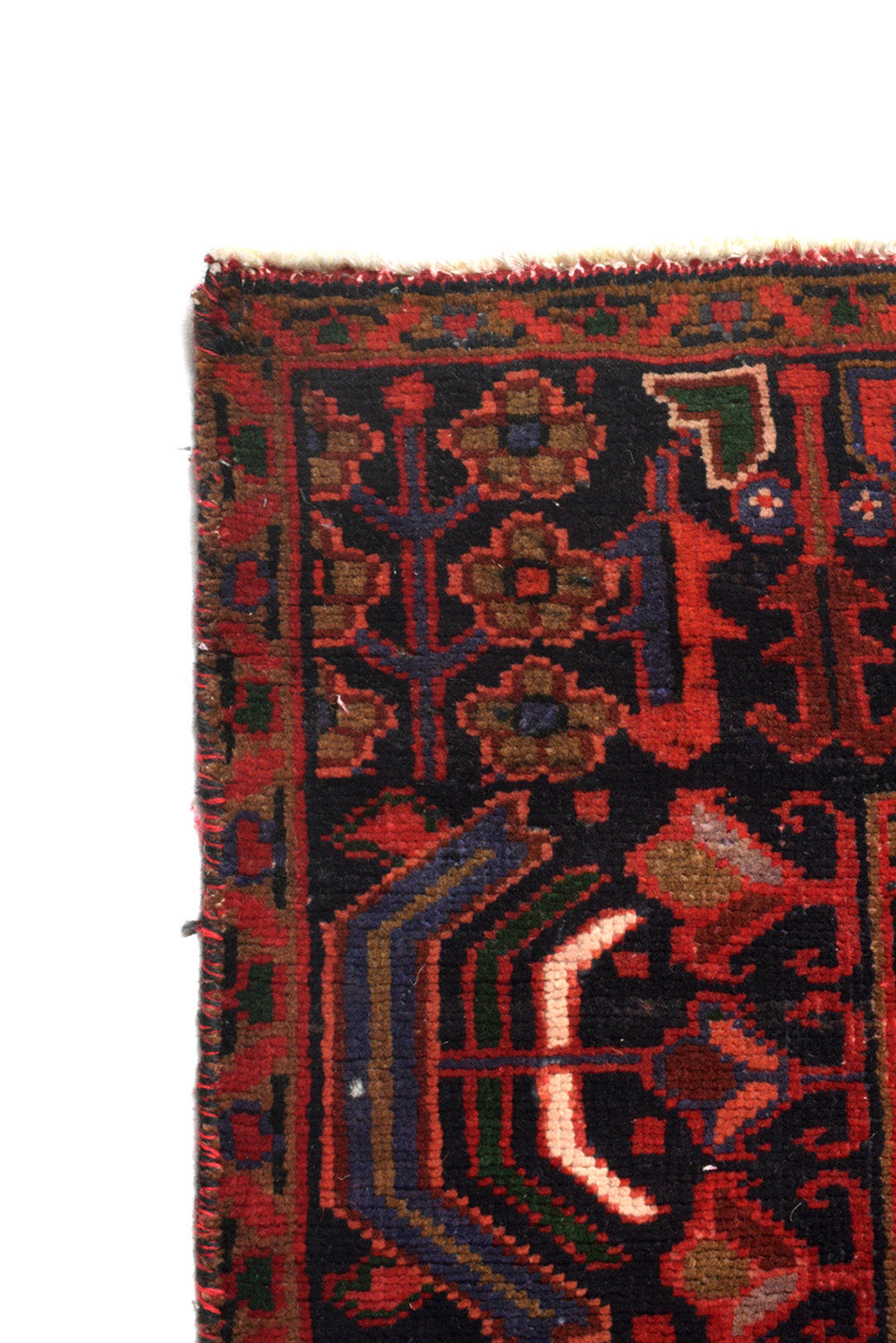 Tribal Heriz-style rug, ivory border pattern detail