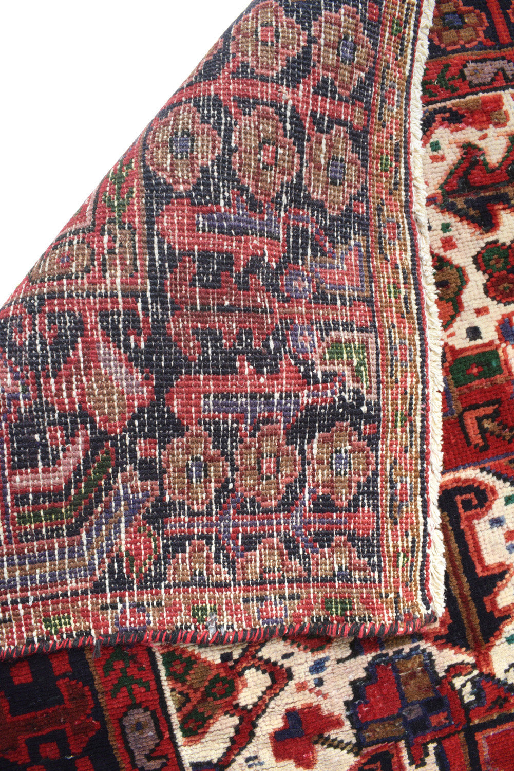 Tribal Heriz-style rug, pile texture close-up showing soft wool