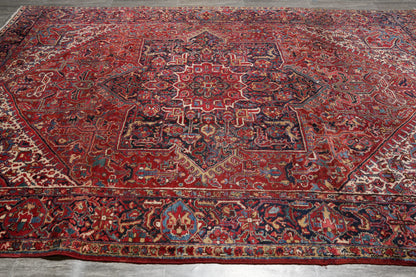 Strong tribal Heriz-style rug, central tribal medallion close-up in ivory and navy
