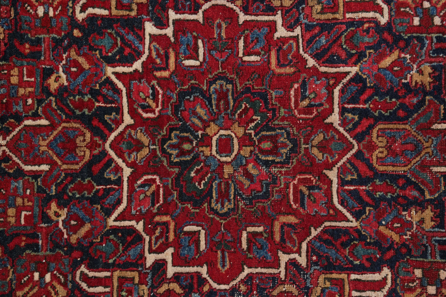 Strong tribal Heriz-style rug, border pattern detail