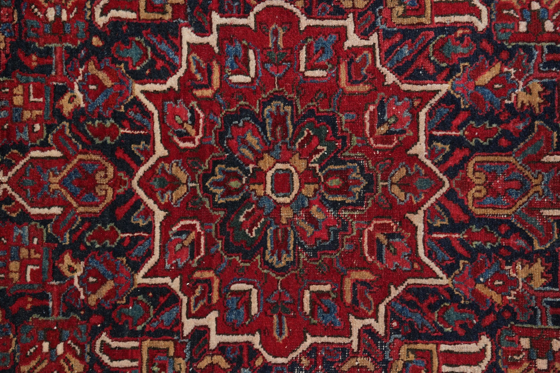 Strong tribal Heriz-style rug, border pattern detail