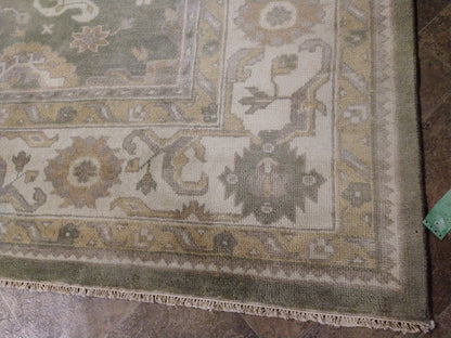 Oushak sage rug, ivory border pattern close-up