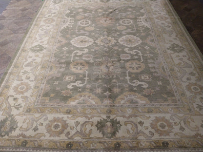 Oushak sage rug, color balance close-up of sage and rust accents